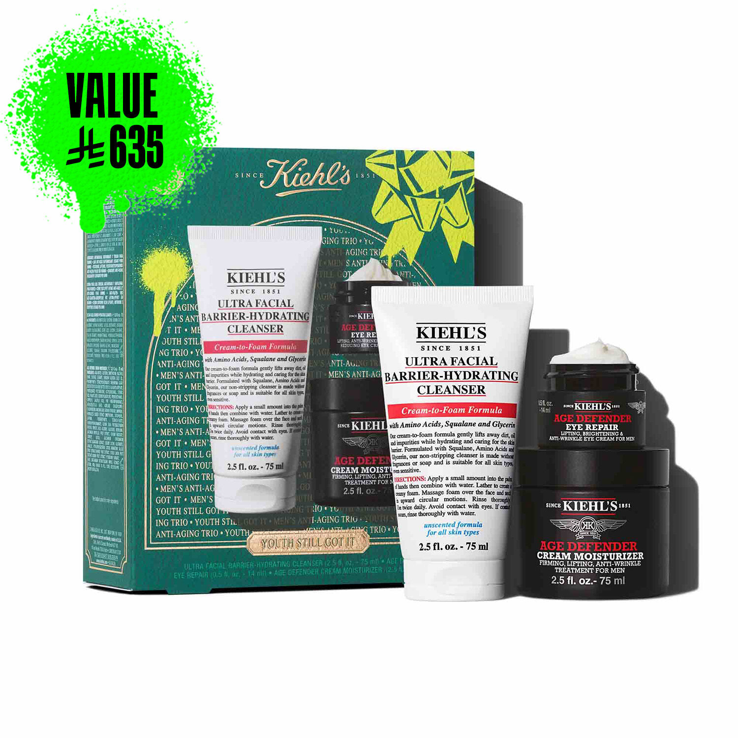 A graphic featuring a dark teal Kiehl’s gift box with white and gold accents on the left. The box contains three products. To the right of the box, the same three products are displayed outside of the box: a white tube of "KIEHL’S ULTRA FACIAL BARRIER-HYDRATING CLEANSER," a small black and red jar of "KIEHL’S AGE DEFENDER EYE REPAIR," and a larger black and red jar of "KIEHL’S AGE DEFENDER CREAM MOISTURIZER." The box is decorated with bright green graphic paint splatters and a bow design and features the text "YOUTH STILL GOT IT" at the bottom.